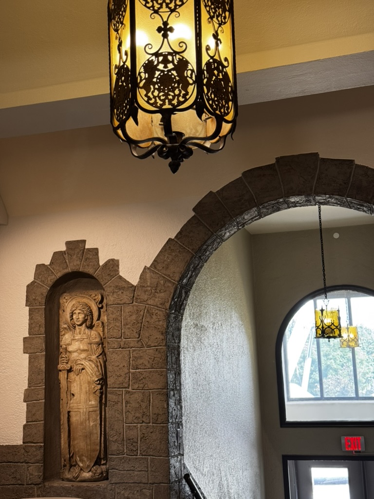 Stone archway and lantern inside a St. Catherine University building