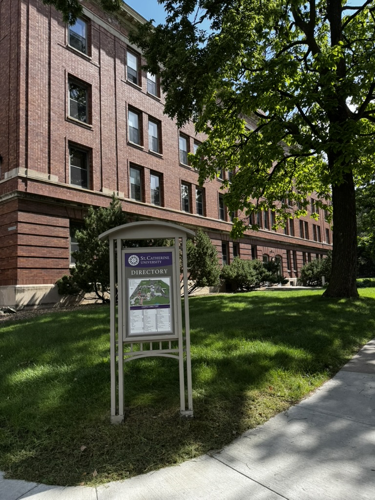 St. Catherine University campus directory in front of a brick academic building