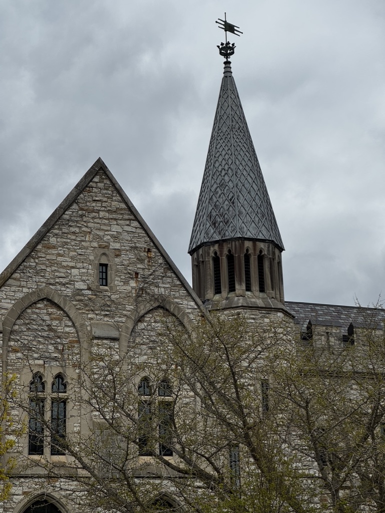 Gothic spire at St. Olaf College rising against a moody sky
