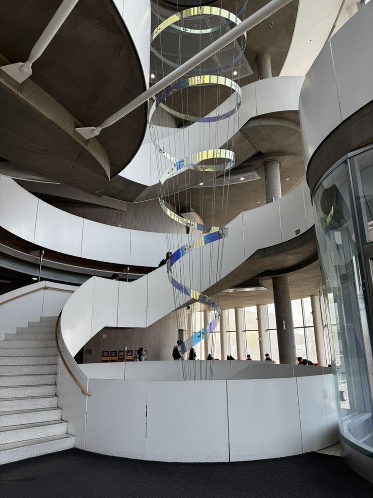 A spiraling white atrium and staircase inside a modern University of Minnesota building